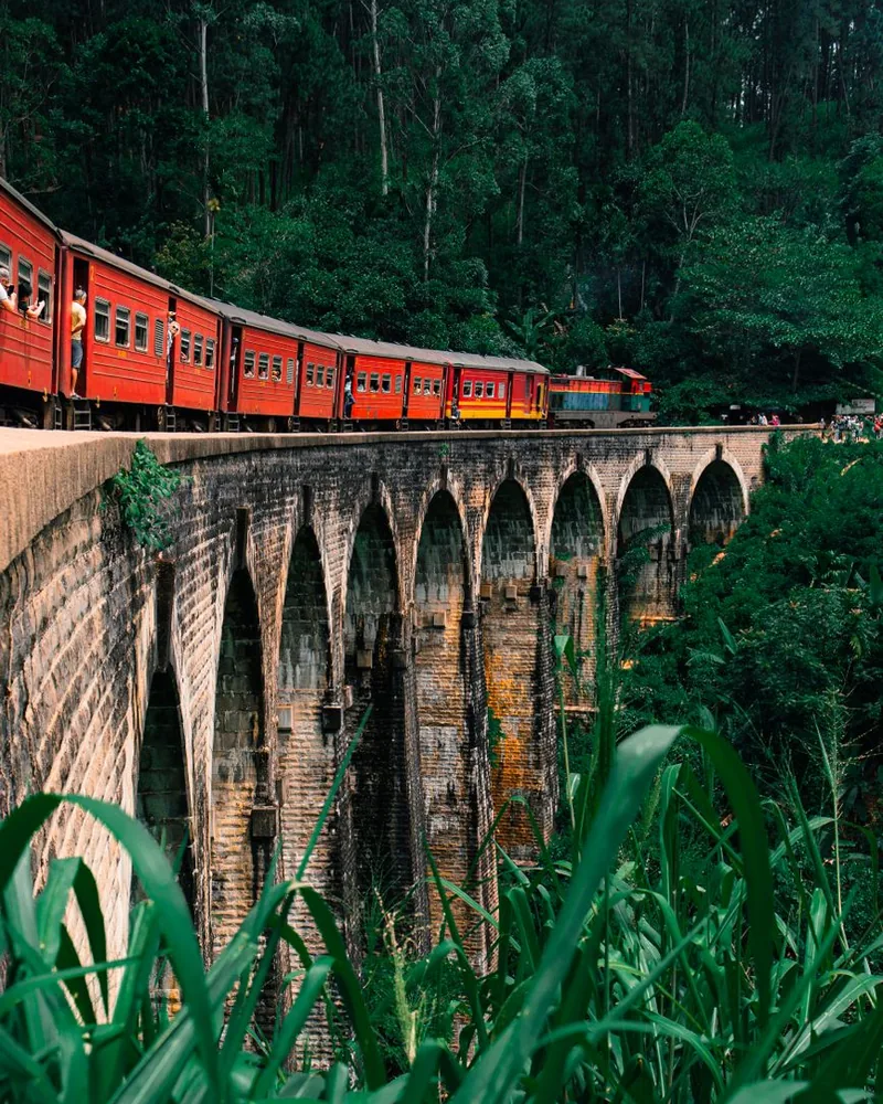 The hill-country train crossing the Nine Arch Bridge near Ella, Sri Lanka