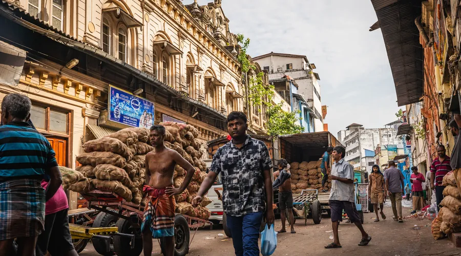 Vendors and shoppers moving through Colombo's bustling Pettah market
