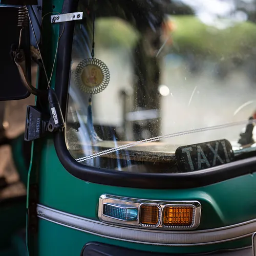 Close-up of a traditional green tuk-tuk taxi